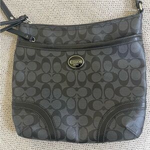 Black cross body. Coach bag.